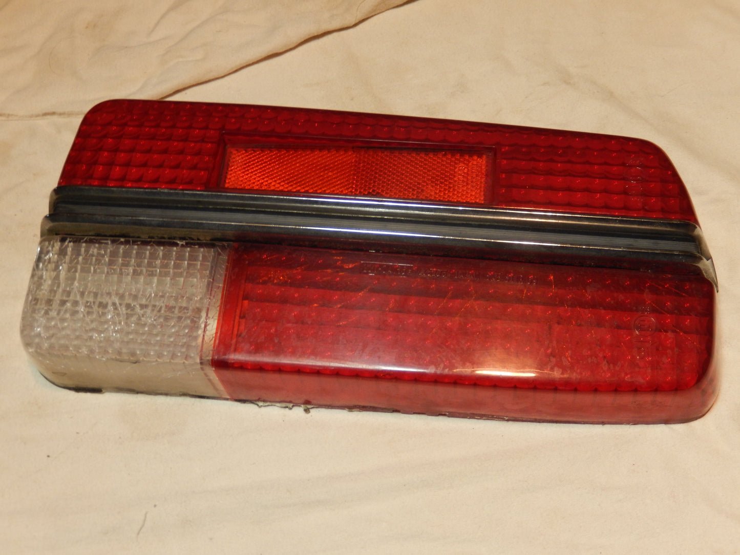 Datsun 240Z Driver's Side Rear Tail Light Lens with Perfect Center Trim